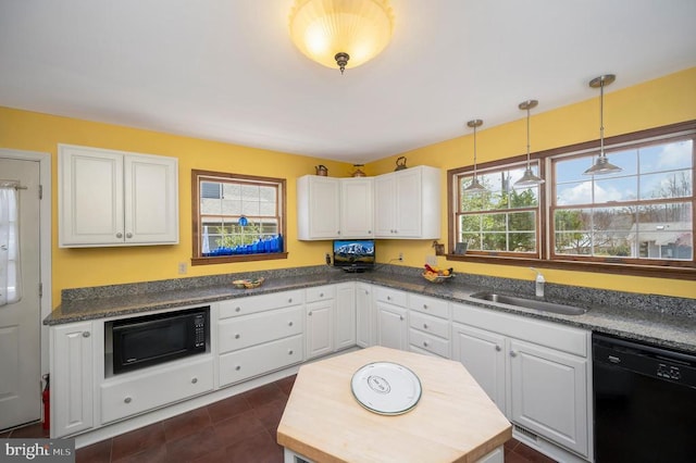 107 Ramsay Rd, Locust Grove, VA 22508 - kitchen with black appliances, a sink, white cabinets, dark countertops, and decorative light fixtures