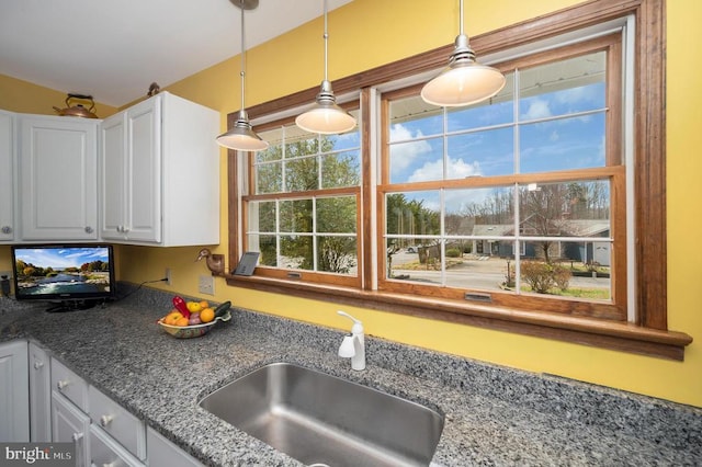 107 Ramsay Rd, Locust Grove, VA 22508 - kitchen with a sink, decorative light fixtures, white cabinetry, and dark stone countertops