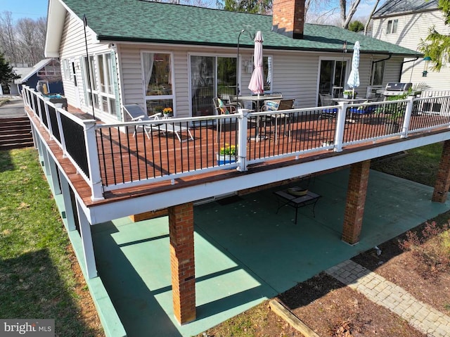 107 Ramsay Rd, Locust Grove, VA 22508 - rear view of house with a chimney, a shingled roof, a deck, a patio area, and outdoor dining space