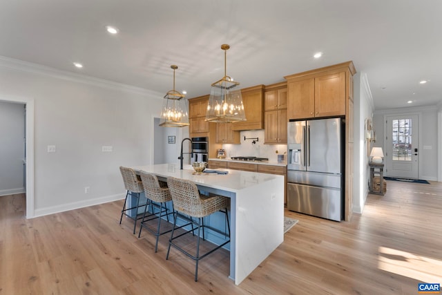 1115 Sablewood Dr, Charlottesville, VA 22911 - kitchen with a breakfast bar area, light wood-type flooring, light countertops, appliances with stainless steel finishes, and ornamental molding