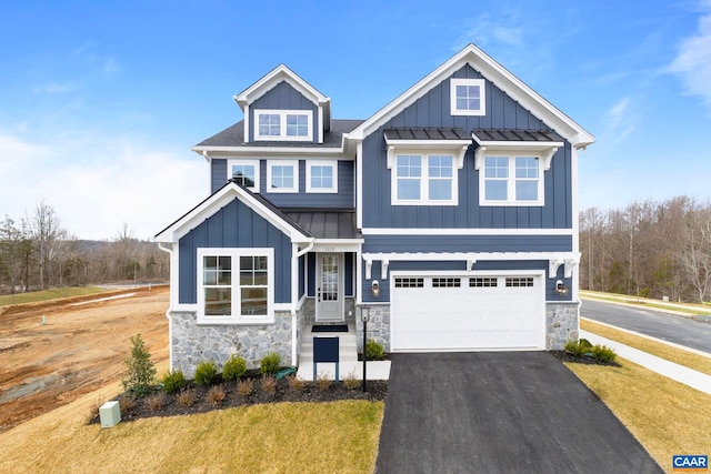 1115 Sablewood Dr, Charlottesville, VA 22911 - craftsman house with an attached garage, a standing seam roof, stone siding, and aphalt driveway