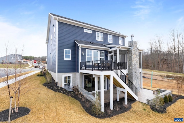 1115 Sablewood Dr, Charlottesville, VA 22911 - back of property featuring a yard, a chimney, a deck, and stairs
