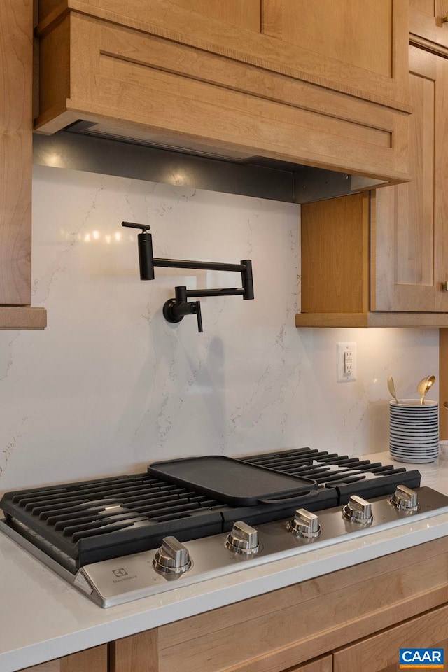 1115 Sablewood Dr, Charlottesville, VA 22911 - interior details featuring light countertops, decorative backsplash, and stainless steel gas stovetop