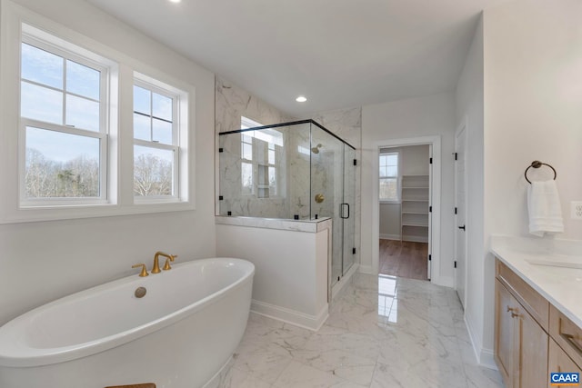 1115 Sablewood Dr, Charlottesville, VA 22911 - bathroom with a freestanding bath, marble finish floor, baseboards, and a stall shower