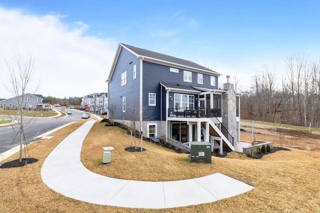1115 Sablewood Dr, Charlottesville, VA 22911 - view of front of home with stairway, a sunroom, a wooden deck, and a front yard