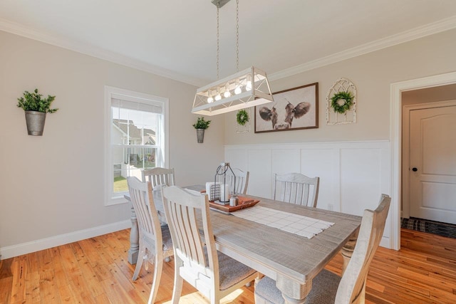 731 Hidden Brook Rd, Mcgaheysville, VA 22840 - dining space with ornamental molding, light wood-type flooring, and a wainscoted wall