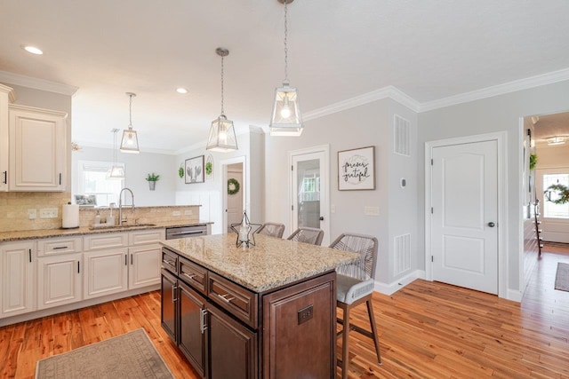 731 Hidden Brook Rd, Mcgaheysville, VA 22840 - kitchen with a breakfast bar, light wood-style floors, crown molding, dishwasher, and tasteful backsplash
