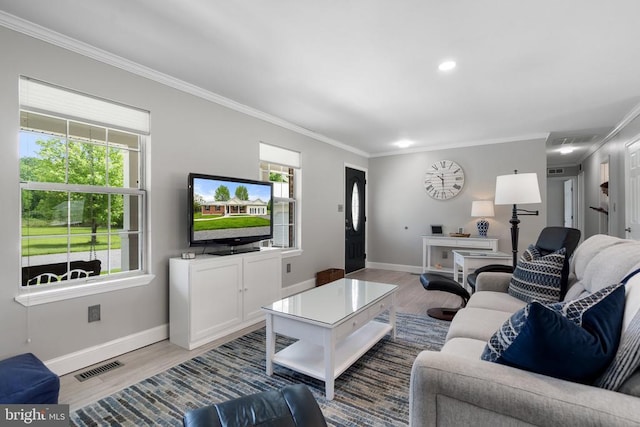  - living area featuring ornamental molding, plenty of natural light, wood finished floors, and recessed lighting