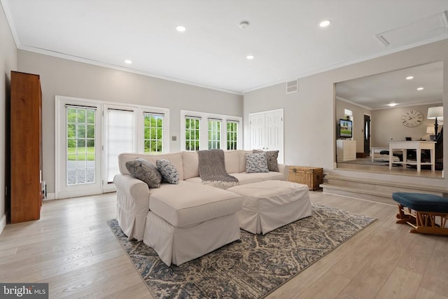  - living area featuring plenty of natural light, ornamental molding, light wood-style flooring, and recessed lighting