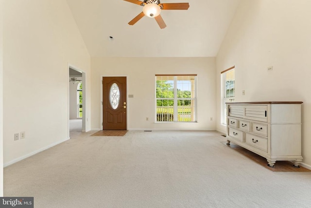  - foyer featuring high vaulted ceiling, a ceiling fan, plenty of natural light, and light carpet