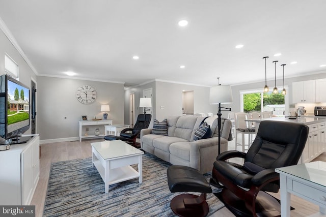  - living room featuring crown molding, recessed lighting, and light wood-style flooring