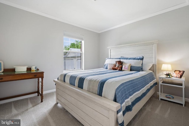  - bedroom featuring carpet flooring and crown molding