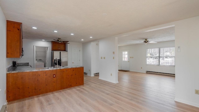 159 Yancey Ct, Mcgaheysville, VA 22840 - kitchen with a peninsula, washer / dryer, stainless steel fridge, and ceiling fan