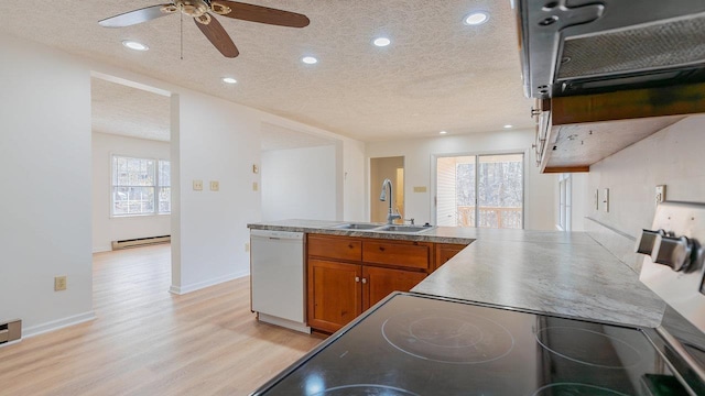 159 Yancey Ct, Mcgaheysville, VA 22840 - kitchen featuring white dishwasher, a textured ceiling, a baseboard heating unit, a sink, and brown cabinets