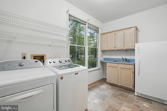 11217 Field Cir, Spotsylvania, VA 22551 - laundry room with washing machine and dryer, a sink, cabinet space, stone finish floor, and a wealth of natural light