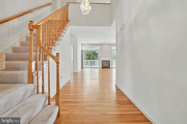 11217 Field Cir, Spotsylvania, VA 22551 - entrance foyer featuring light wood-style floors, stairway, a high ceiling, and a notable chandelier