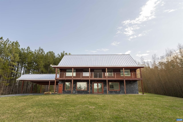 4323 Carter Rd, Schuyler, VA 22969 - rear view of house featuring metal roof, a carport, driveway, a yard, and a forest view