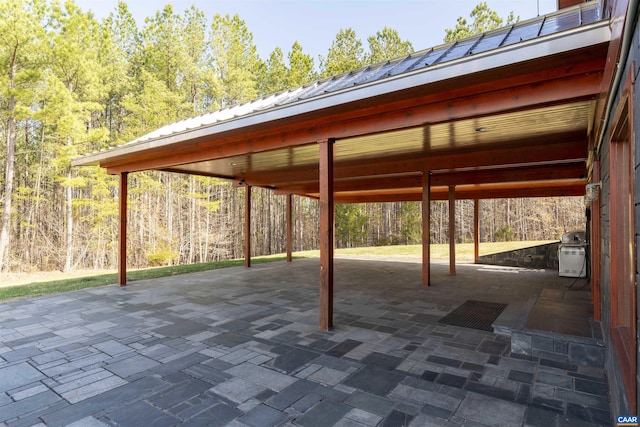 4323 Carter Rd, Schuyler, VA 22969 - view of patio / terrace with grilling area, a carport, and a view of trees
