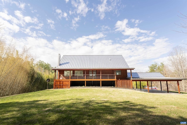 4323 Carter Rd, Schuyler, VA 22969 - rear view of house with a yard, a chimney, metal roof, and a carport