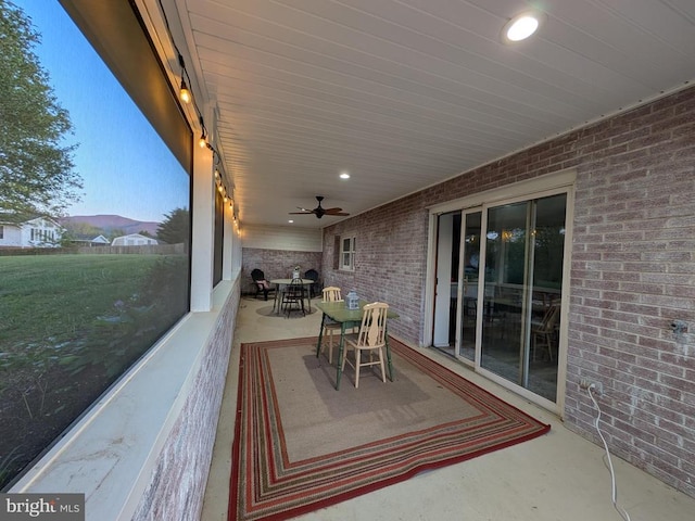 view of patio / terrace with a ceiling fan and outdoor dining space