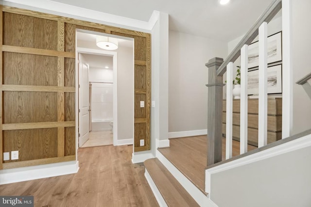  - corridor featuring wood finished floors and baseboards