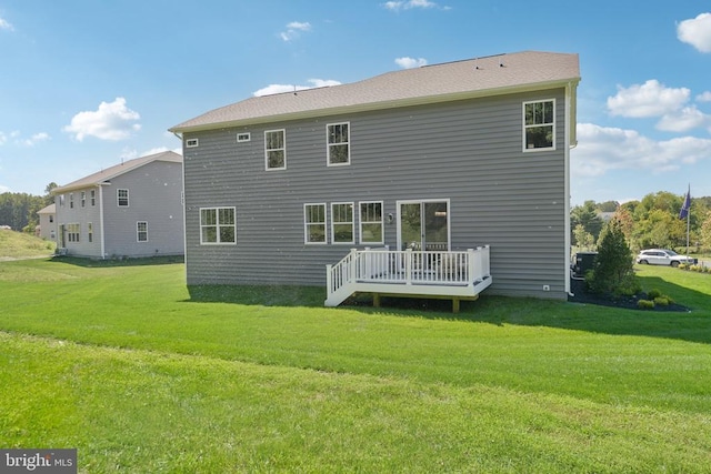  - back of property with a yard and central air condition unit