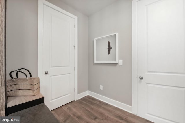  - unfurnished bedroom with dark wood finished floors and baseboards