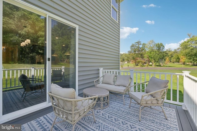  - wooden deck featuring a yard