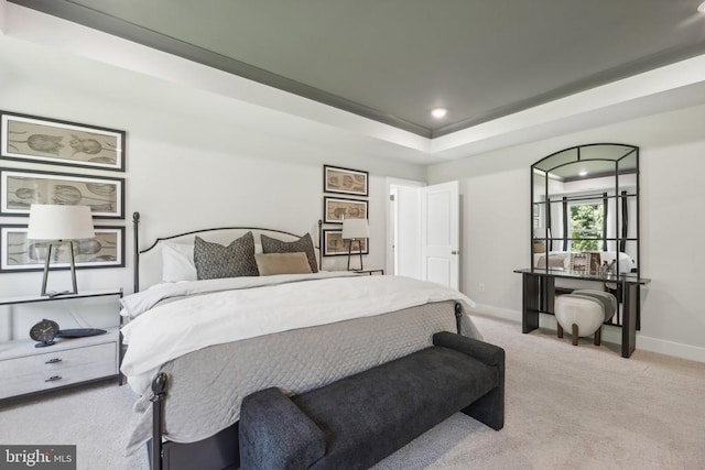  - carpeted bedroom featuring baseboards, recessed lighting, and a raised ceiling