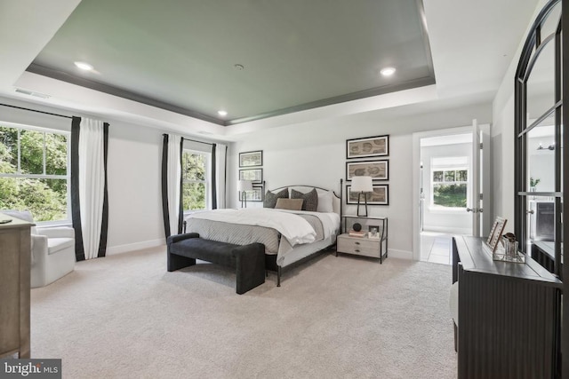  - bedroom with a raised ceiling, baseboards, carpet, multiple windows, and recessed lighting