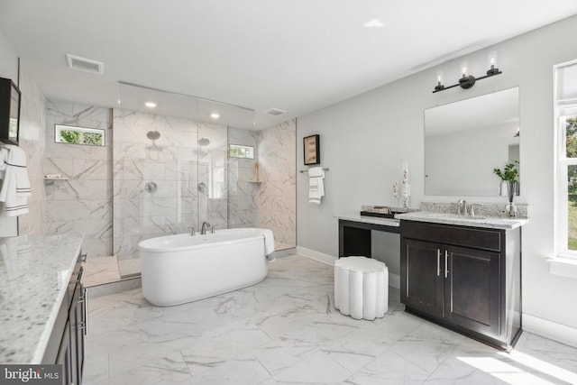  - bathroom featuring marble finish floors, vanity, baseboards, a soaking tub, and a marble finish shower