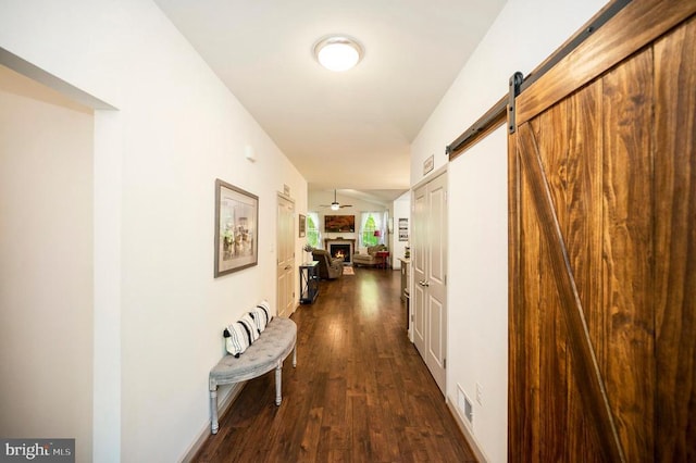 846 Confederate Dr, Locust Grove, VA 22508 - corridor featuring dark wood finished floors, visible vents, and a barn door