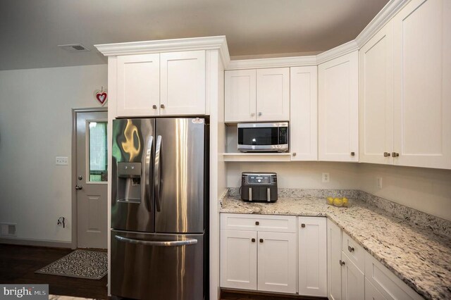 846 Confederate Dr, Locust Grove, VA 22508 - kitchen with white cabinets, dark wood finished floors, baseboards, appliances with stainless steel finishes, and light stone counters