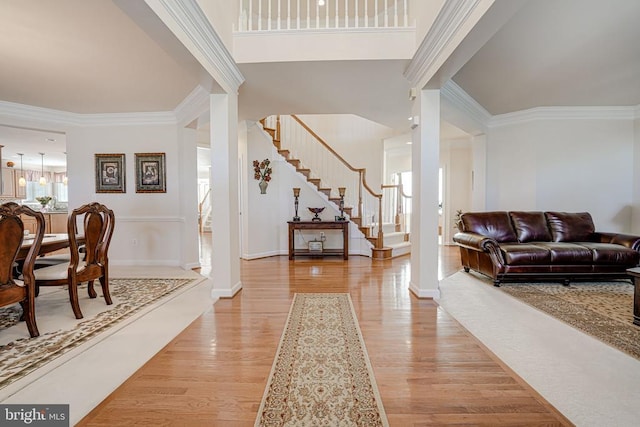 11512 Balmartin Ct, Spotsylvania, VA 22553 - entryway featuring decorative columns, light wood-type flooring, stairs, ornamental molding, and baseboards