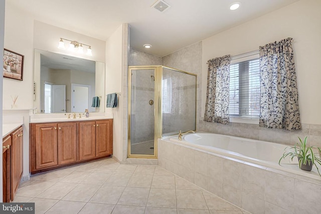 11512 Balmartin Ct, Spotsylvania, VA 22553 - full bath featuring vanity, a shower stall, a garden tub, and tile patterned floors