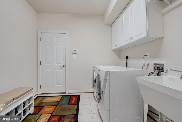11512 Balmartin Ct, Spotsylvania, VA 22553 - laundry area with cabinet space, washing machine and clothes dryer, and light tile patterned floors