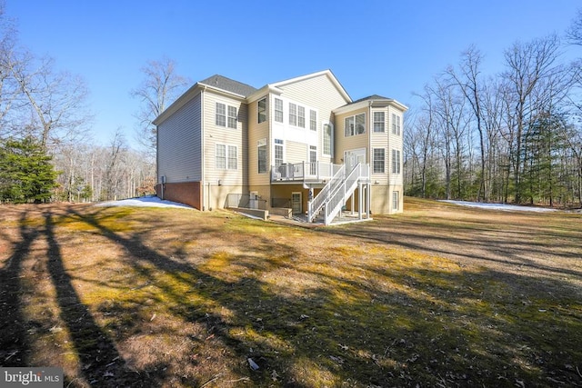 11512 Balmartin Ct, Spotsylvania, VA 22553 - back of house featuring stairway, a wooden deck, and a yard