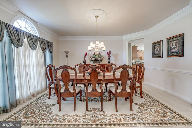 11512 Balmartin Ct, Spotsylvania, VA 22553 - dining area with a chandelier, crown molding, baseboards, and light carpet