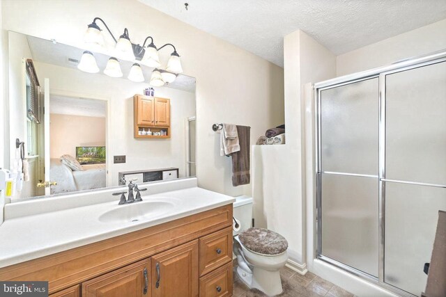 9128 Woodbrook Ln, Culpeper, VA 22701 - bathroom featuring a stall shower, toilet, connected bathroom, and vanity
