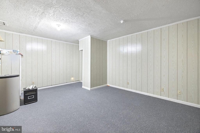 9128 Woodbrook Ln, Culpeper, VA 22701 - basement featuring crown molding, carpet, a textured ceiling, and wooden walls