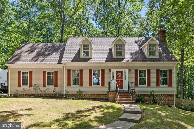 9128 Woodbrook Ln, Culpeper, VA 22701 - new england style home featuring a front lawn and a chimney