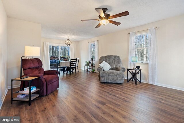 9128 Woodbrook Ln, Culpeper, VA 22701 - living area featuring dark wood finished floors, a ceiling fan, and baseboards