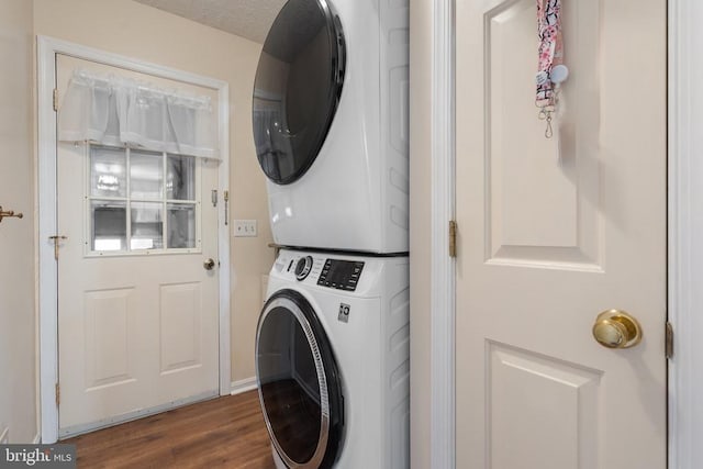 9128 Woodbrook Ln, Culpeper, VA 22701 - clothes washing area featuring stacked washer and clothes dryer and dark wood-style floors