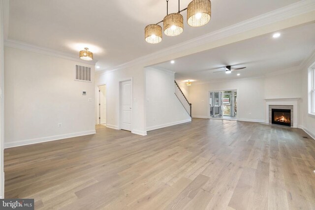 57 Madison St, Warrenton, VA 20186 - unfurnished living room with light wood finished floors, stairs, crown molding, baseboards, and recessed lighting