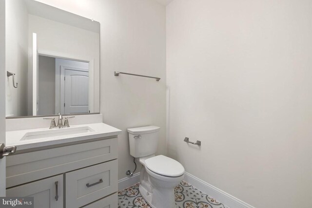 57 Madison St, Warrenton, VA 20186 - half bathroom featuring baseboards, toilet, and vanity