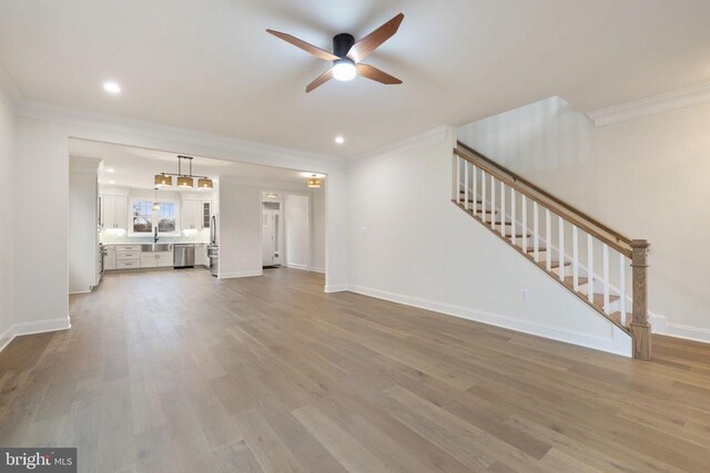 57 Madison St, Warrenton, VA 20186 - unfurnished living room featuring stairway, a ceiling fan, crown molding, light wood finished floors, and baseboards