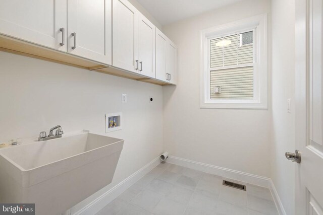 57 Madison St, Warrenton, VA 20186 - clothes washing area with cabinet space, hookup for a washing machine, electric dryer hookup, and baseboards