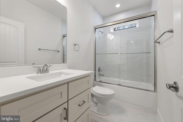 57 Madison St, Warrenton, VA 20186 - full bath with marble look tiles, bath / shower combo with glass door, toilet, vanity, and baseboards