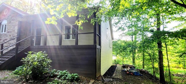 view of property exterior with stone siding