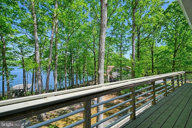 wooden deck featuring a water view